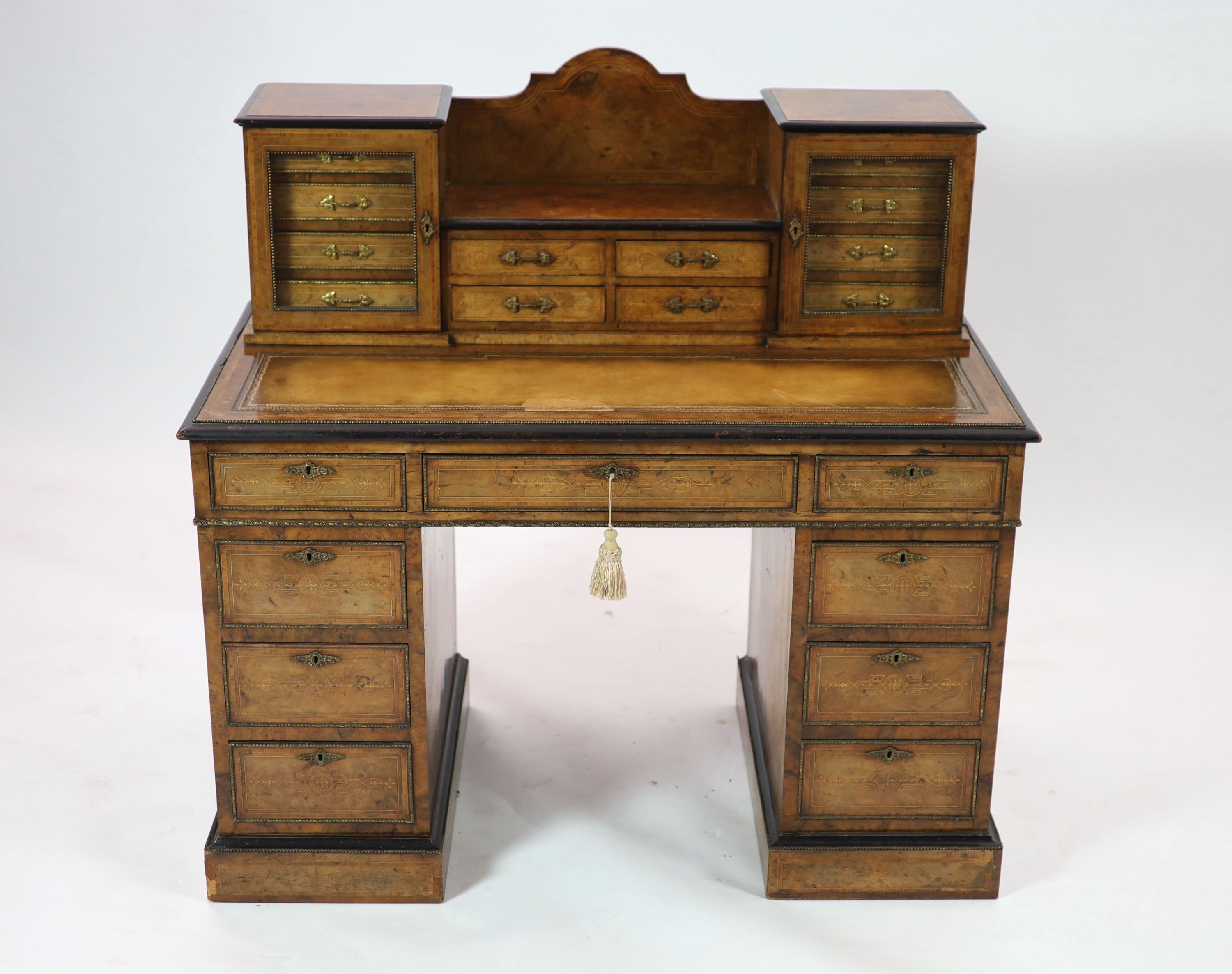An Edwards & Roberts inlaid burr walnut pedestal desk, H 109cm. W 110cm. D 62cm.